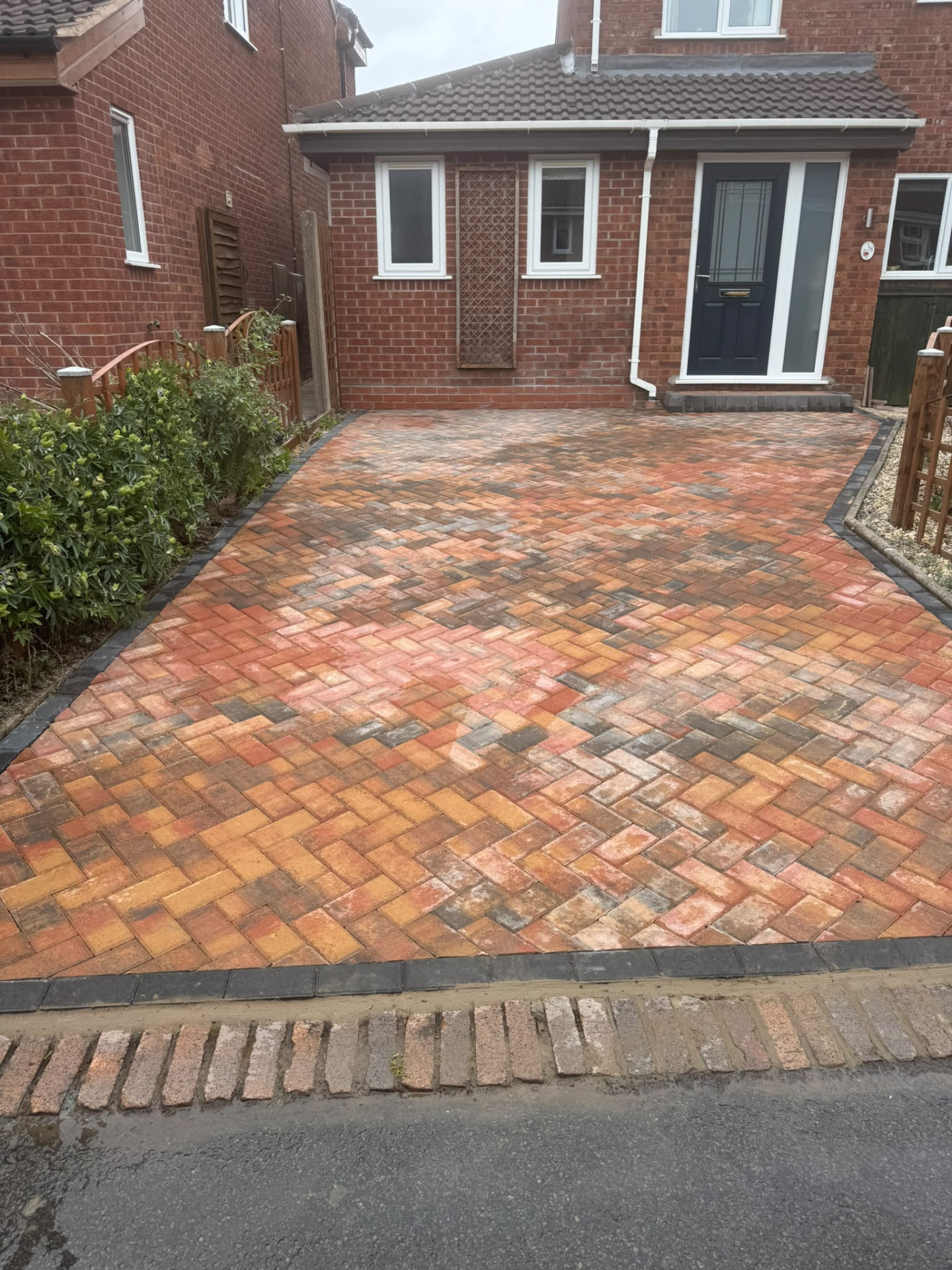 Herringbone block paving driveway in autumn tones with charcoal border — Shropshire